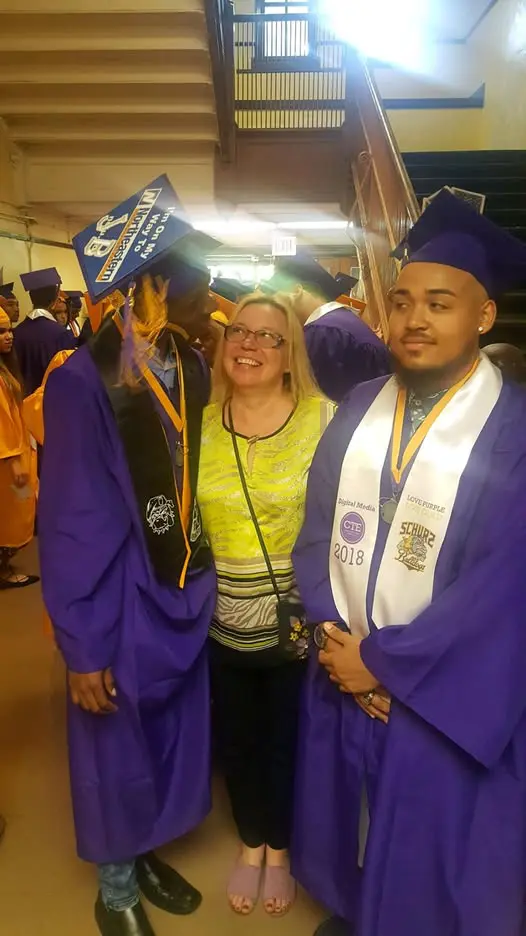67cf41f335a64_I am going to college A woman standing next to two graduates.