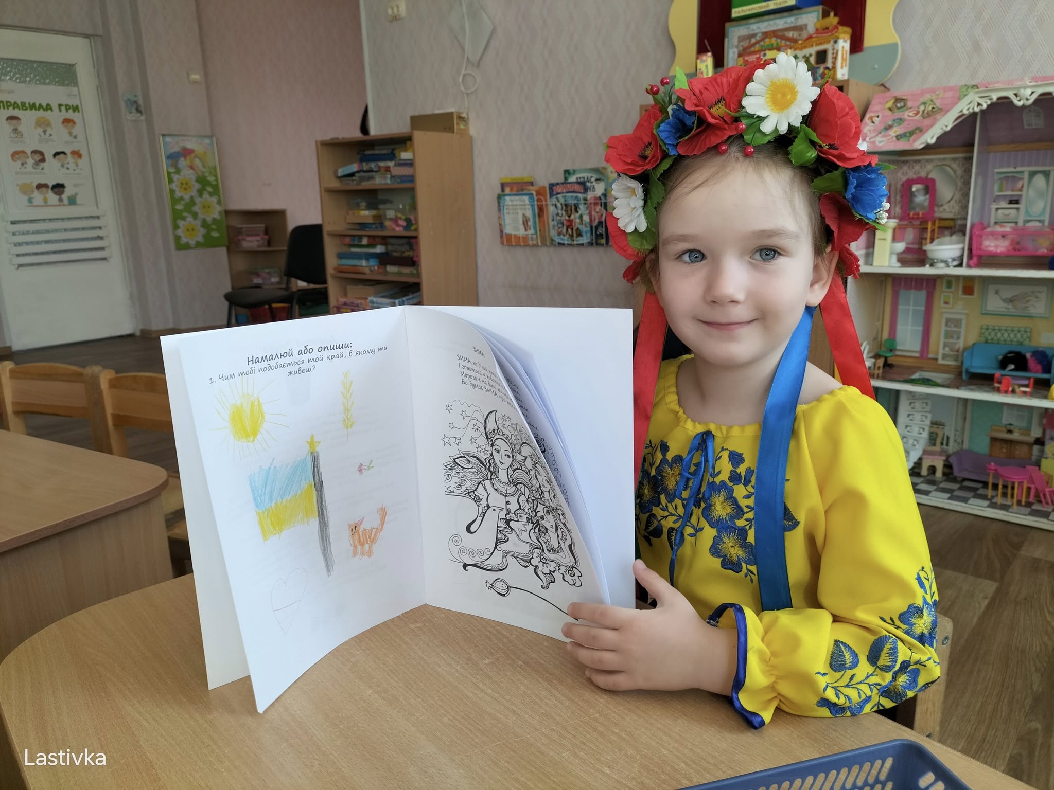 beautifulukrainamria A girl in yellow dress holding open book.